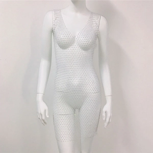 Close-up of white mesh rhinestone dress showing detailed sparkling gems and sheer fabric