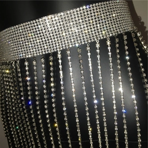 Detail view of silver rhinestone waist chain with sparkling fringe tassels on mannequin