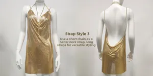 Detail view of the golden metal mesh mini dress with adjustable chain straps and open back