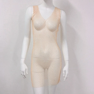 Close-up of champagne rhinestone mesh dress with shimmering crystals and deep V-neck