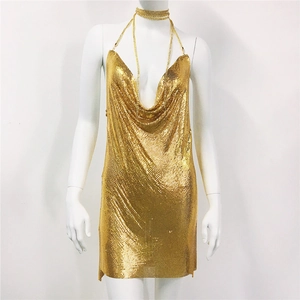 Detailed view of shimmering gold metallic mesh fabric on sexy halter party dress
