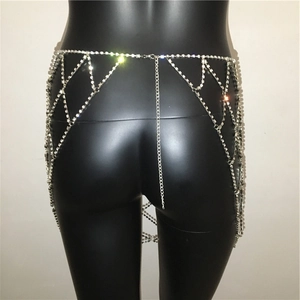 Detailed macro view of silver rhinestone waist chain with adjustable metal mesh link