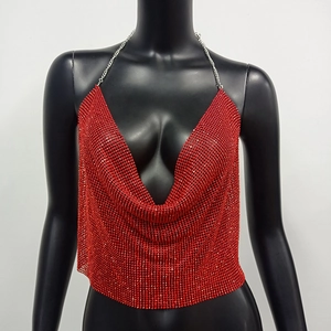 Detailed macro view of red sequin metal mesh top with sparkling rhinestone chains