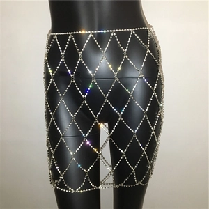 Macro detail of sparkly silver rhinestone body chain with diamond mesh grid structure