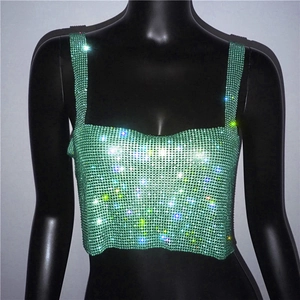 Macro detail of sparkly green rhinestone crop top featuring metallic mesh sequins