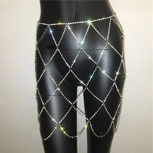 Detail of silver rhinestone mesh body chain with diamond lattice design on mannequin