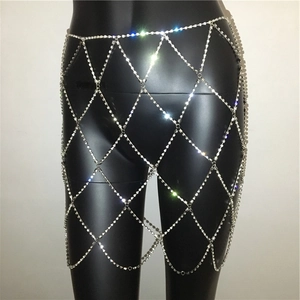 Close-up of sparkling silver rhinestone body chain with geometric diamond mesh structure