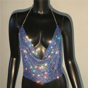 Detail of blue rhinestone mesh halter top with deep V-neck and shimmering metal rings