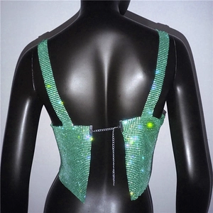 Close-up of green rhinestone sequin crop top with silver metal chain back strap