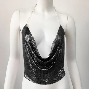 Detail of black metallic sequin halter top with a deep V-neck for festival fashion