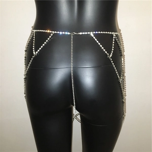 Detail of silver rhinestone waist chain with layered fringe on a model mannequin