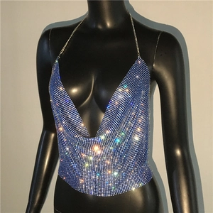 Detailed macro view of deep blue rhinestone halter top with glittering metallic chain straps