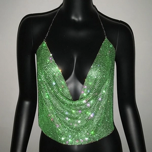 Detail of green sequin halter top with metallic mesh and shimmering rhinestones