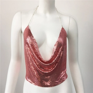 Detail of rose gold sequin halter top featuring metallic chain straps and draped V-neckline