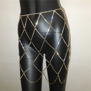 Detail of gold rhinestone mesh body chain with diamond lattice pattern for women