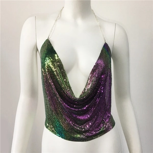 Macro detail of gradient purple and green sequin fabric with silver metal chain straps