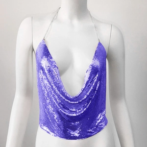 Detailed macro view of purple metallic sequin mesh fabric on a deep V-neck halter top