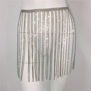 Close-up of sparkling rhinestone fringe waist chain with layered silver metal tassels