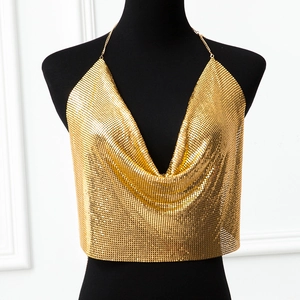 Detailed close-up of golden metal sequin halter top with deep V-neck and mesh texture