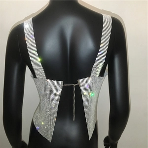 Detailed view of the sparkling silver rhinestone mesh top with back metal chain straps