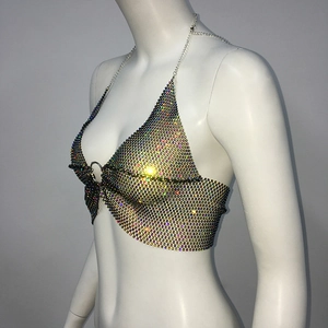 Detail of rhinestone mesh halter top with metallic ring and shimmering colorful crystals