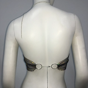 Detail of black rhinestone fishnet bikini top with silver chains and lobster clasp closure