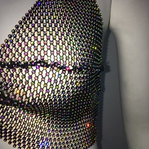Detail of rhinestone mesh top showing colorful crystals on black fishnet structure