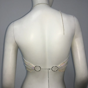 Detail of rhinestone fishnet bikini top featuring adjustable silver chains and metal rings