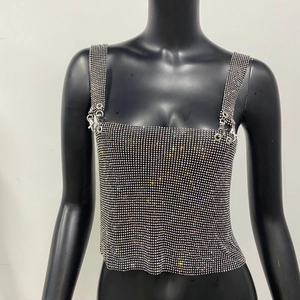 Detail of silver rhinestone camisole top featuring metal rings and hook buckle straps