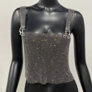 Close-up of sparkling silver rhinestones on a square neck crop top with metal hardware