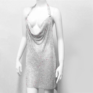 Detail of silver metallic mesh sequins on a sexy deep V-neck halter party dress