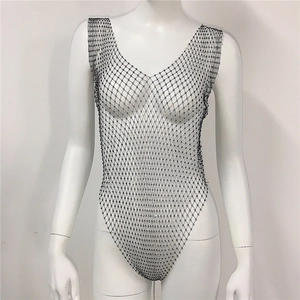 Macro shot of black fishnet bodysuit with sparkling rhinestones and deep V-neckline