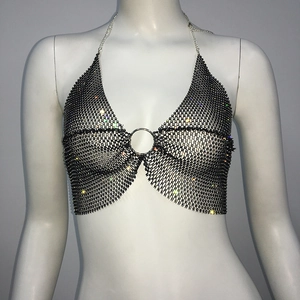 Close-up of black rhinestone fishnet halter top with central silver ring detail