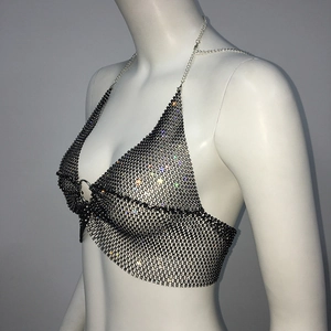 Detail of rhinestone fishnet bikini top with metal ring and halter neck chain