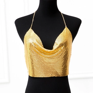 Close-up of golden metallic sequin halter top featuring chain neck straps and mesh texture