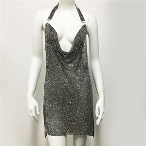 Detailed view of silver sequin mini dress with deep V-neck and halter design