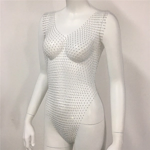 Detailed close-up of mesh bodysuit with silver rhinestones on a white mannequin