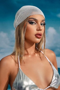 Sparkling silver rhinestone mesh headscarf for party wear shown against a blue sky
