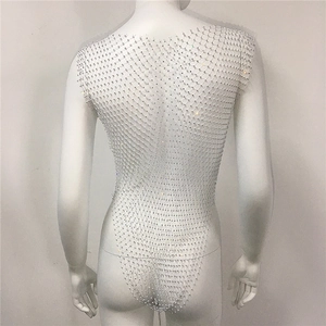 Macro shot of silver rhinestone mesh bodysuit with hollow-out grid and high-cut detail