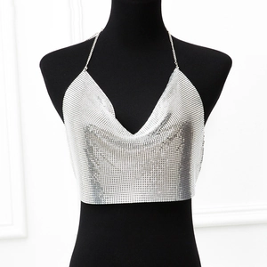 Detail of silver metallic mesh crop top with deep V-neck and delicate chain straps