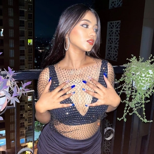 Sparkly black fishnet long sleeve top with silver rhinestones and sheer mesh design
