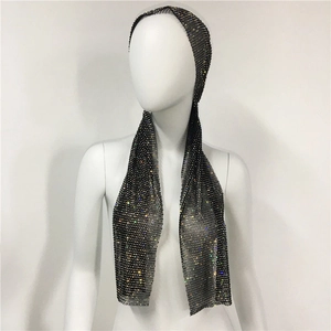 Detail shot of black mesh headpiece featuring vibrant sparkling rhinestones for party wear