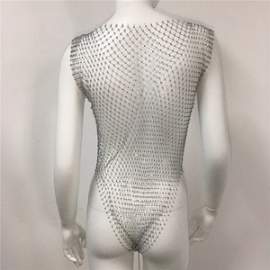 Detailed view of rhinestone fishnet body chain with sparkling gems on a white mannequin