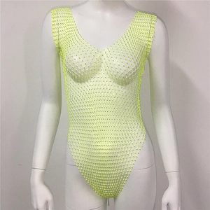 Detail of neon green fishnet bodysuit with sparkling rhinestones and a deep V-neck design
