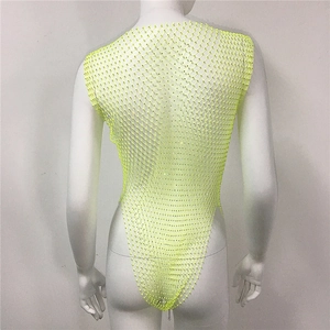 Detailed back view of neon yellow rhinestone fishnet bodysuit on a white mannequin