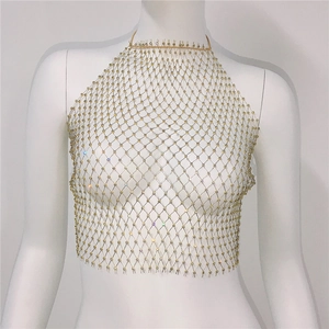 Detail of light gold mesh body chain with sparkling rhinestones in a diamond grid pattern