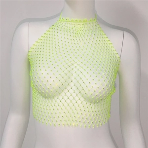 Detailed close-up of neon green mesh halter top with shimmering rhinestones