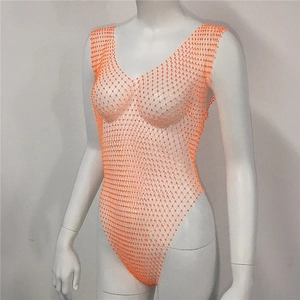 Detailed close-up of orange rhinestone mesh bodysuit fabric and elastic netting