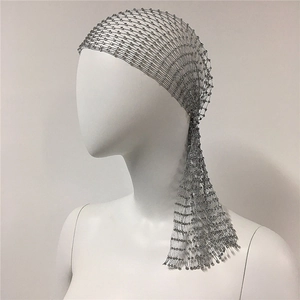 Macro detail of sparkling rhinestone fishnet headpiece with elegant silver fringe tassels