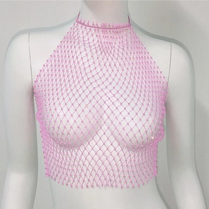 Close-up of pink fishnet halter top with sparkly rhinestones and diamond mesh
